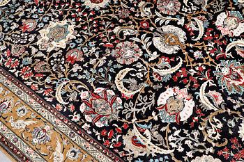 A Ghom silk carpet, approx. 309 x 200 cm.