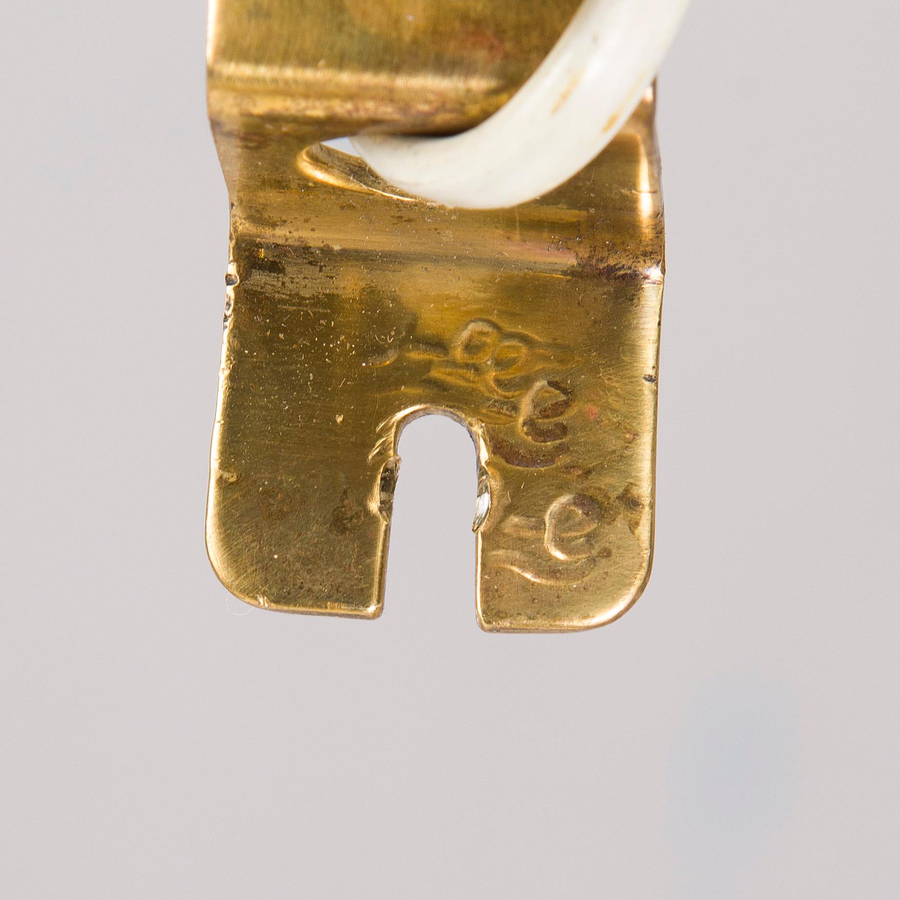 A mid-20th century wall light for Valinte, Finland.