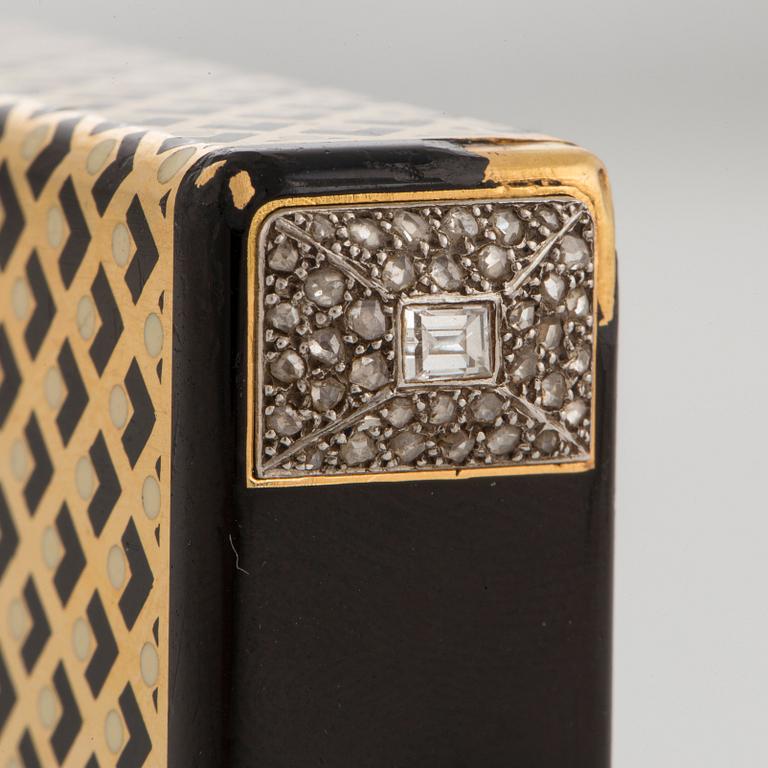 A Cartier Art Deco Vanity Case in 18K gold with enamel and baguette- and rose-cut diamonds.