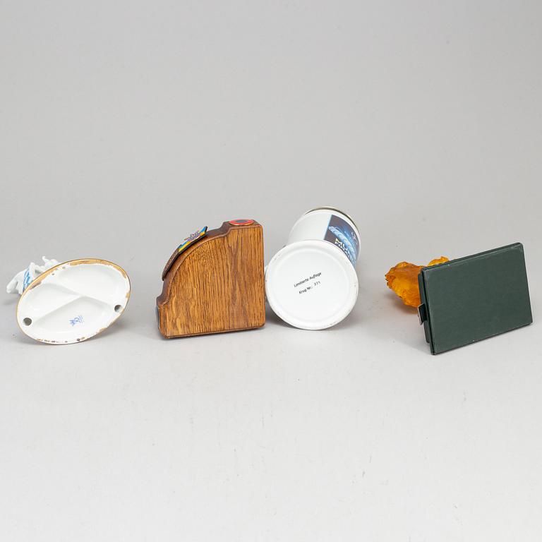 Four sculptures and a jug.