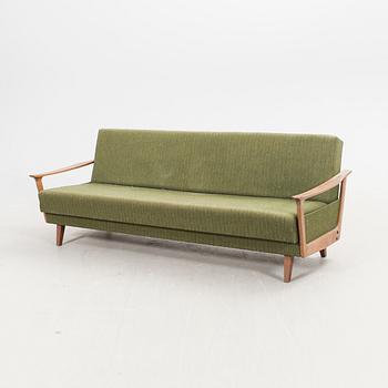 A 1960s teak sofa bed.