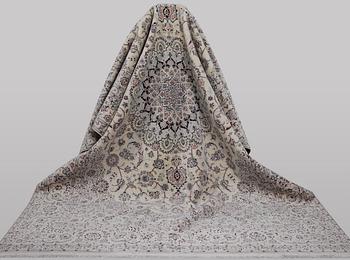 A carpet, Nain, part silk, ca 341 x 245 cm.