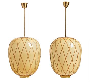 221. A pair of Swedish Modern vanilla coloured glass ceiling lights with fretted rattan, 1930-40's.