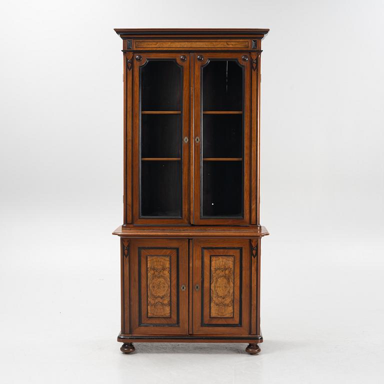 A mahogany veneered book cabinet, around 1900.