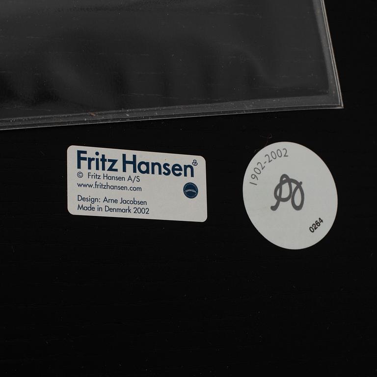 An Arne Jacobsen "Centenary Package" comprising three "Ant Chairs" and an eggshaped table, Fritz Hansen, Denmark.