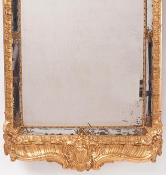 A Swedish rococo carved giltwood and gesso mirror, later part of the 18th century.
