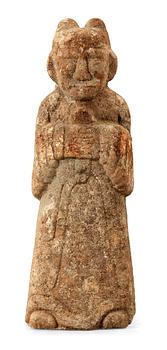 A stone sculpture of a guardian, presumably Han dynasty.