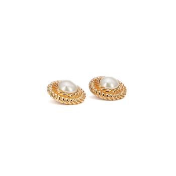 584. CHANEL, a pair of decorative pearl earclips set in gold colored metal.