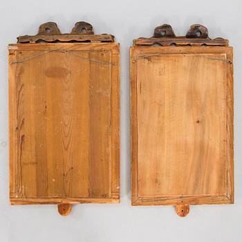 A pair of mirrored wall sconces from the latter half of the 20th century.