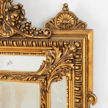 A Baroque style mirror, circa 1900.