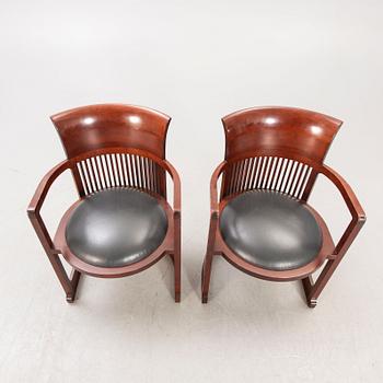 A pair of "606 Barrel Taliesin" armchairs by Frank Lloyd Wright for Cassina 1989, signed and numbered 28459, 28581.