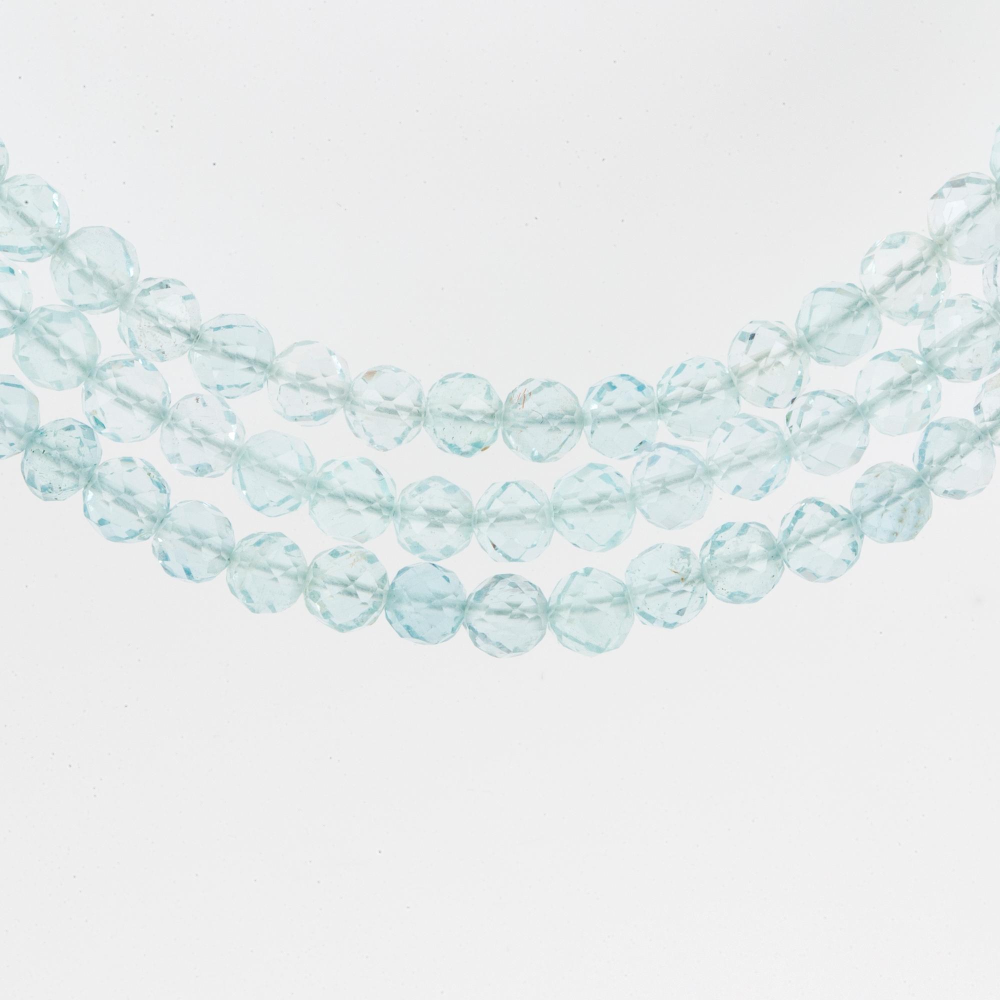 A Tiffany & Co three strand faceted aquamarine bead necklace with an 18K white gold clasp.