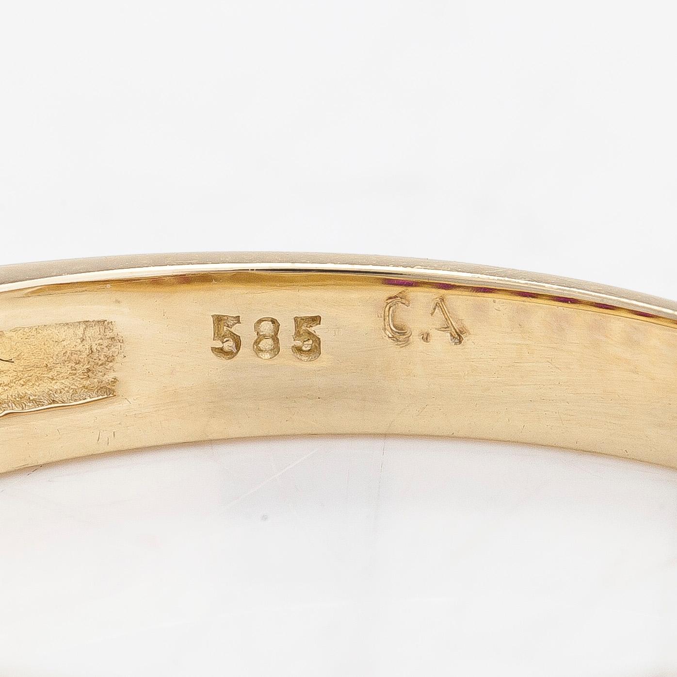 A 14K half eternity gold ring, with rubies.