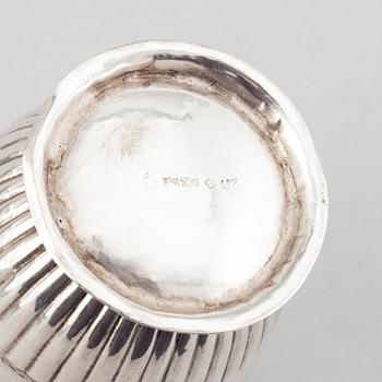 A silver creamer, beaker, and platter, Sweden, 18-19th century.