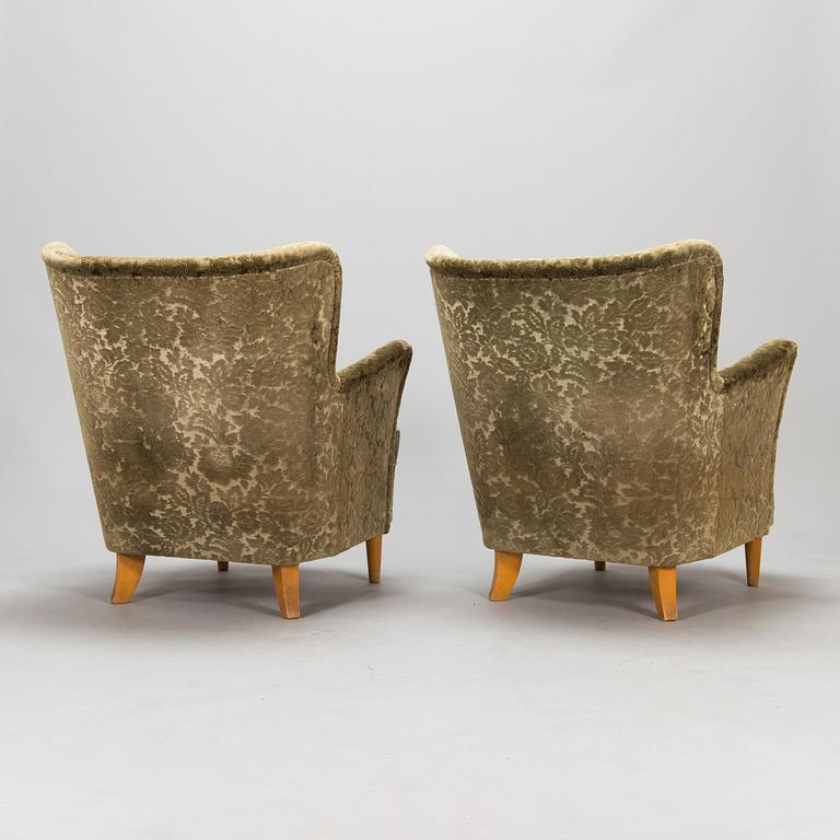 A pair of 1950s armchairs.