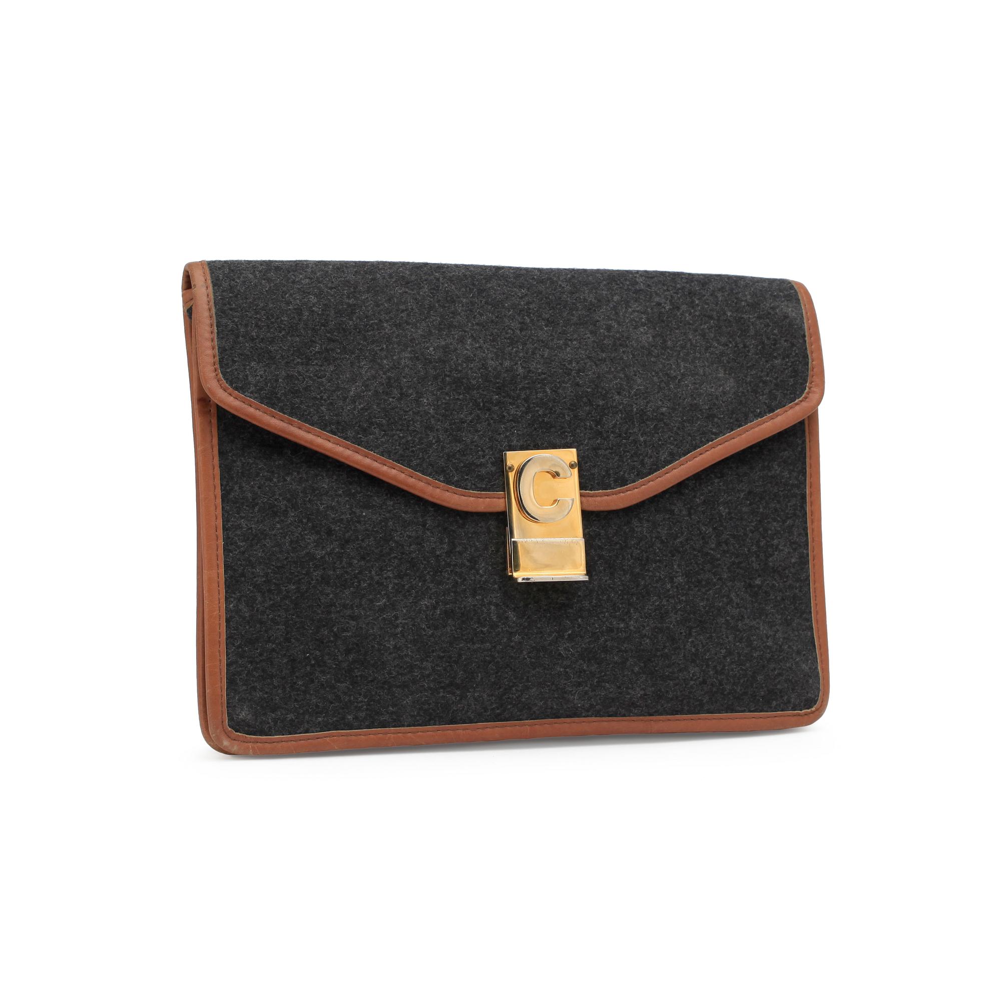 CÉLINE, a grey clutch bag.