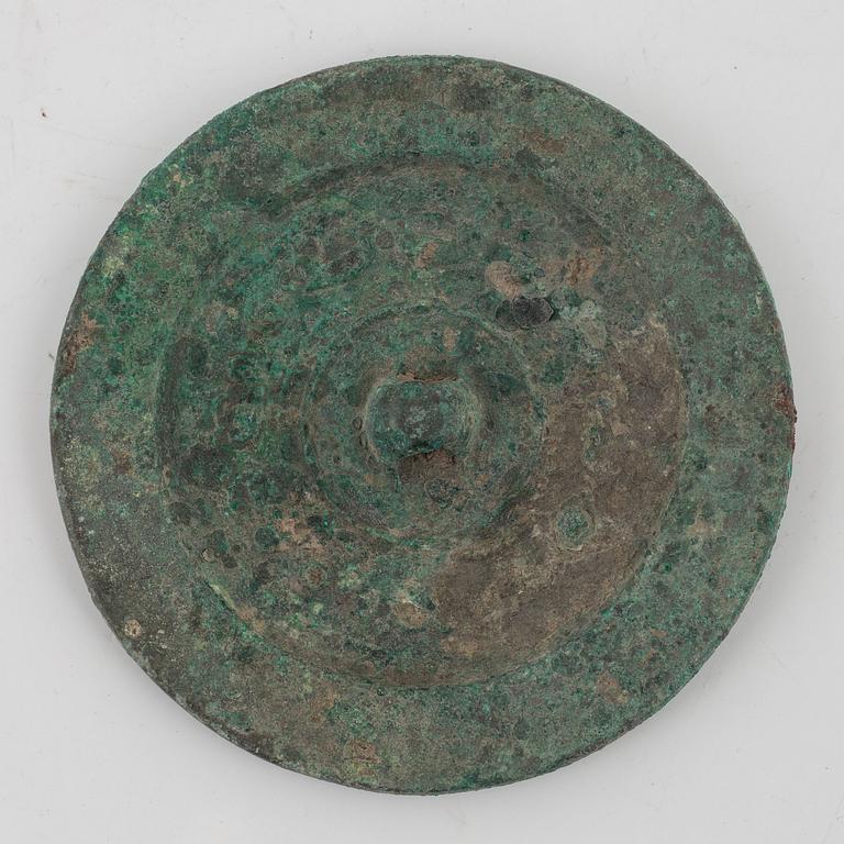 Four bronze lobed mirrors,  Han dynasty (206 B.C.-220 A.D.).