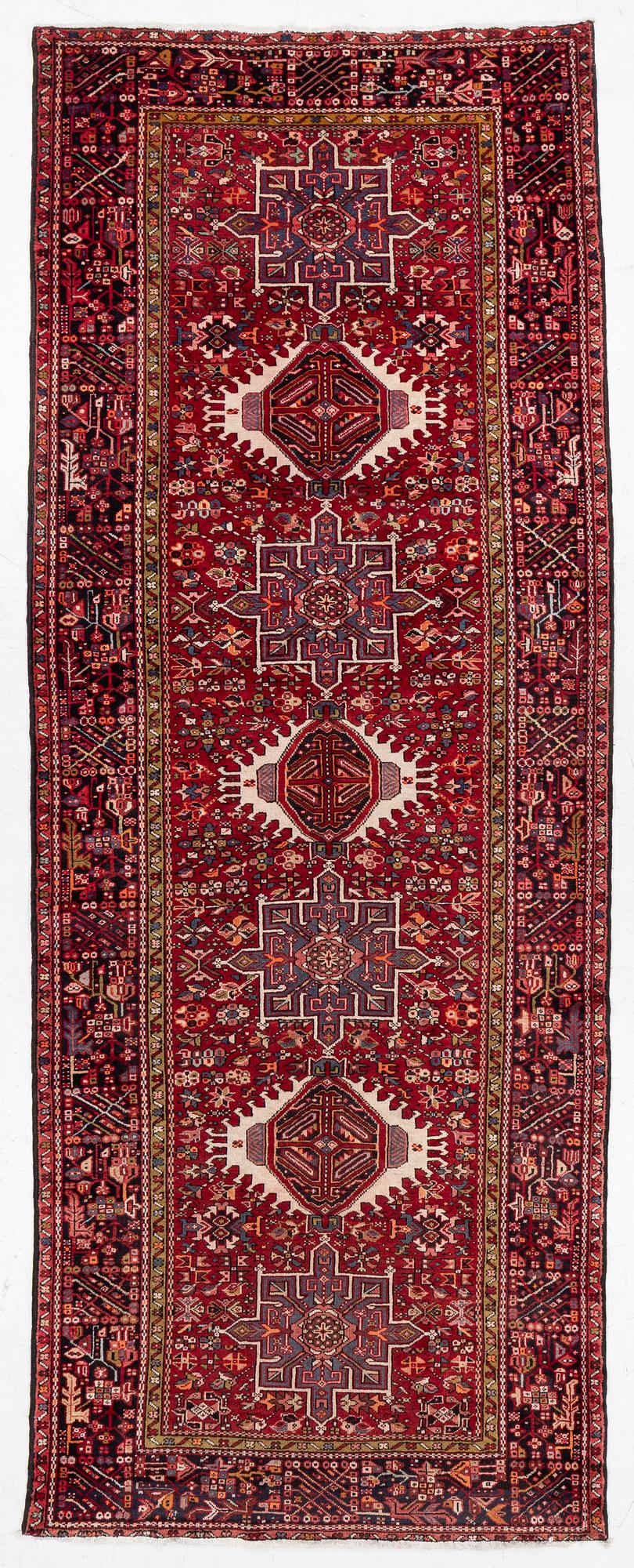 A semi-antique Karadja runner, c. 405 x 155 cm.
