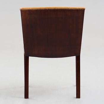 Frits Henningsen, a stained mahogany and brown leather armchair, Denmark.