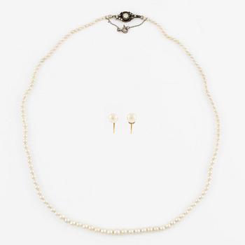 Pearl necklace with graduated cultured pearls, clasp in silver set with pastes, and a pair of pearl earrings,.