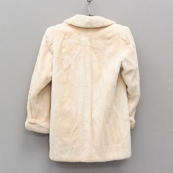 YVES SAINT LAURENT, a fur coat, size ca medium.
