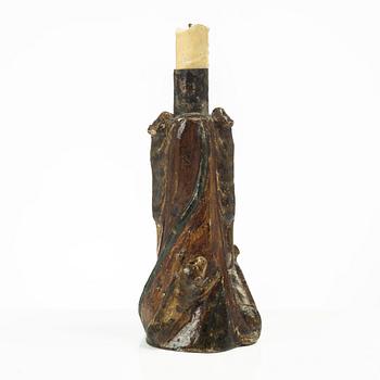 A Swedish folk art carved candlestick, 19th century.
