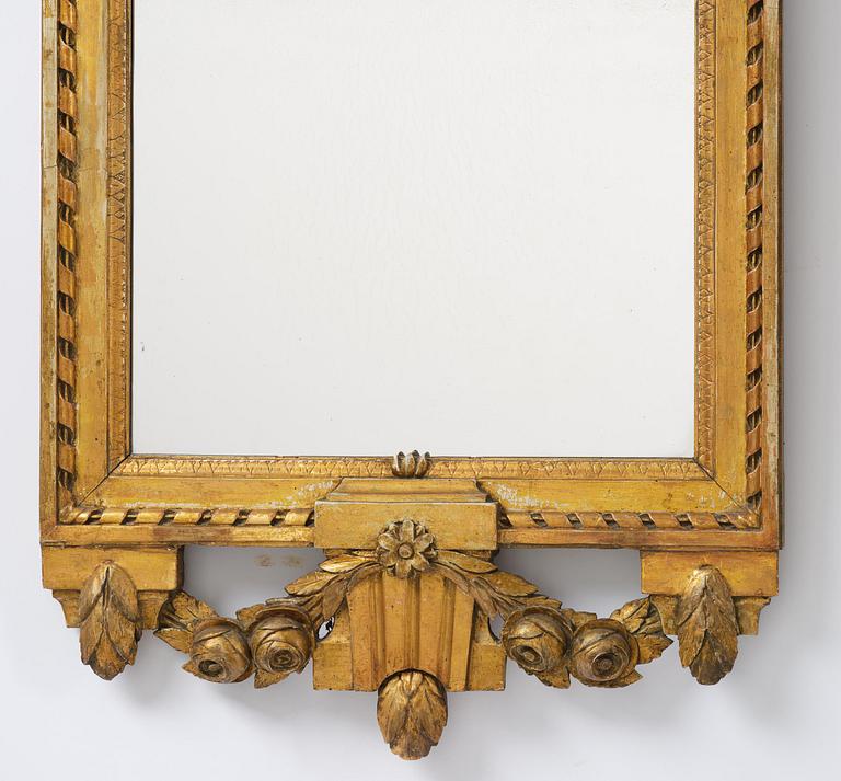 A Gustavian giltwood mirror by C. G. Fyrwald (master in Stockholm 1776-1825).
