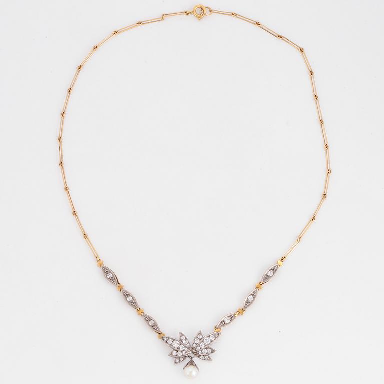 18K gold necklace with white stones and pearl.