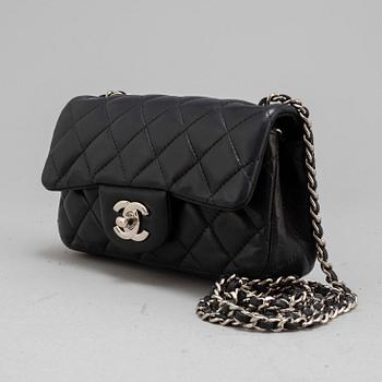 CHANEL, a black leather 'Extra mini flap bag' 2012-13.
