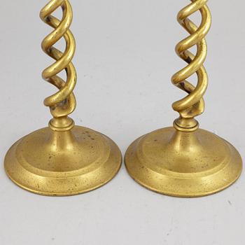 A pair of brass candle sticks. possibly English, circa 1900.