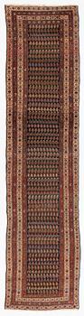 An antique runner carpet, approx. 400 x 93 cm.