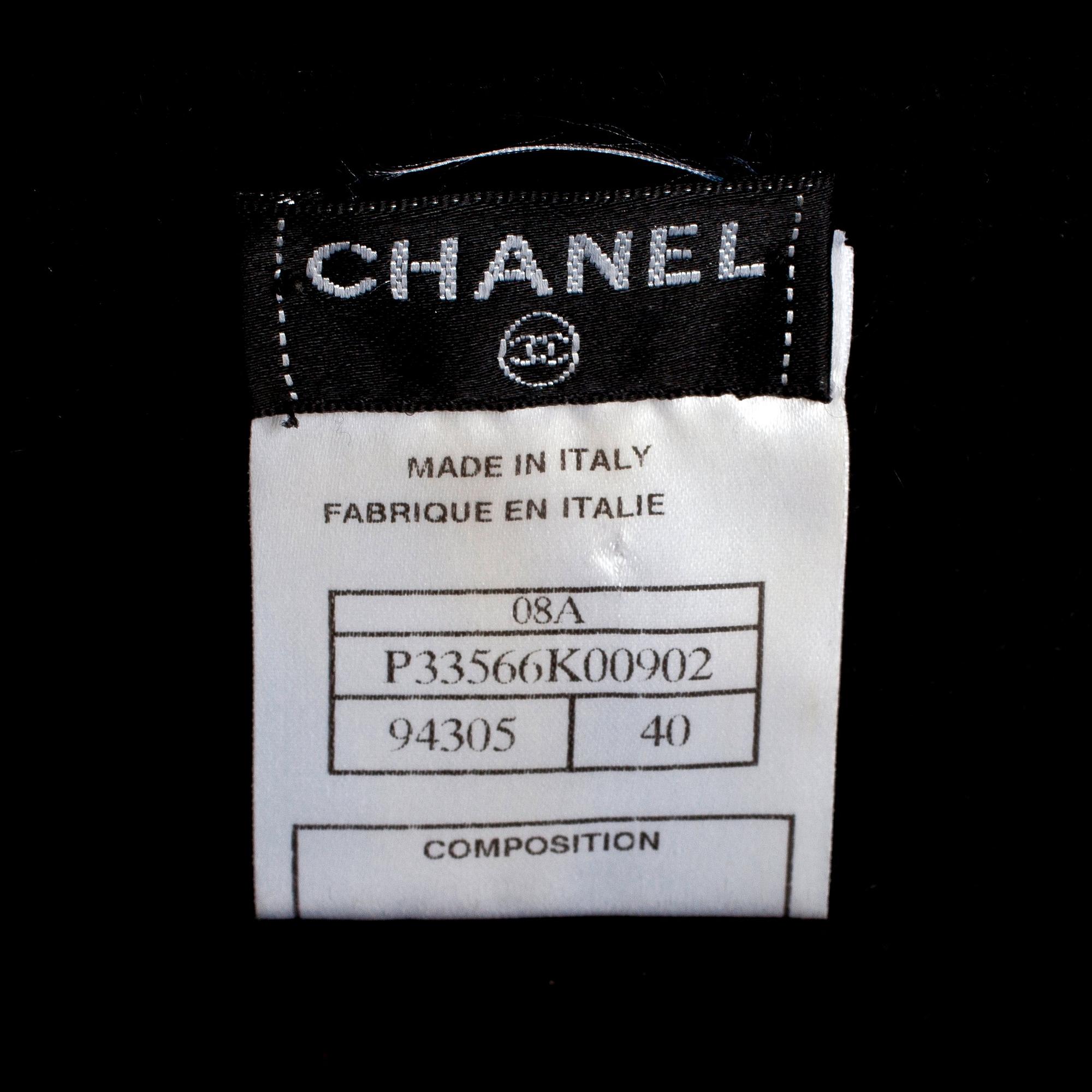 CHANEL, a black cashmere carding and a bouclé skirt.