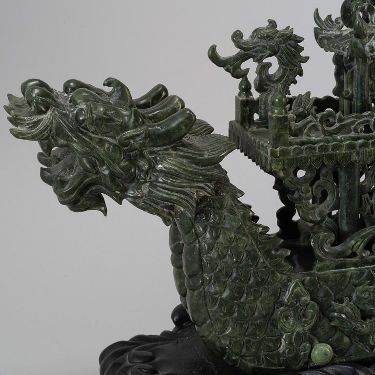 A large Chinese green stone carved sculpture, 20th century.