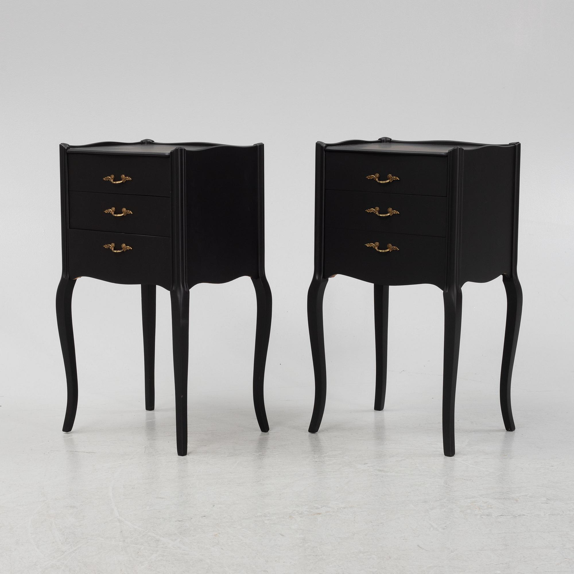 A painted pair of bedside tables.
