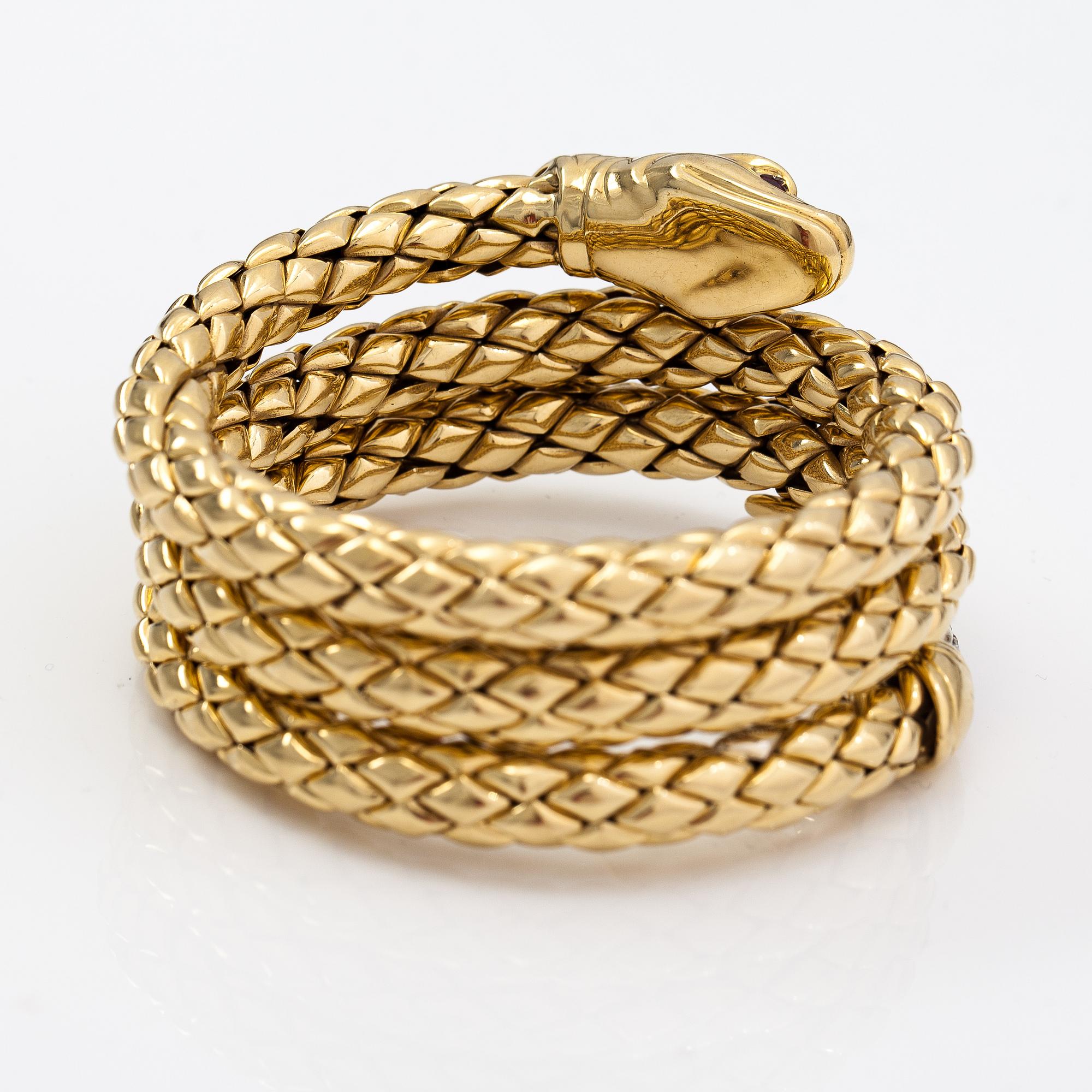 Chimento, An 18K gold snake bracelet with rubies and diamonds ca. 0.46 t in total. Italy.