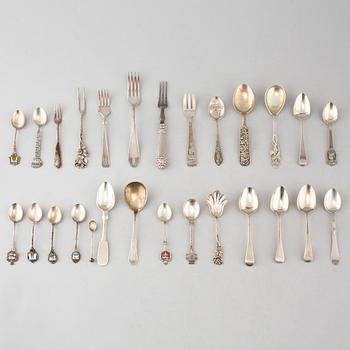 A collection of silver of 57 pcs, i.a souvenir spoons, 20th century. Total weight 1073 g.