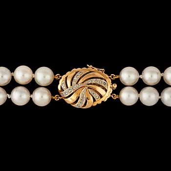 108. A two strand cultured pearl necklace, 8.2 mm, clasp set with brilliant cut diamonds, total carat weight circa 0.20ct.