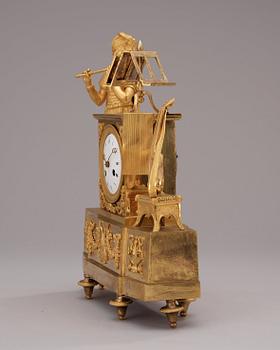 A French Empire early 19th century gilt bronze mantel clock.