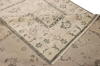 An oriental carpet, c. 360 x 280 cm.