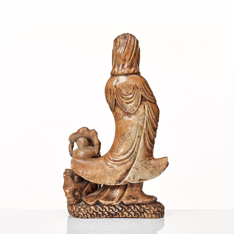 A soapstone sculpture of Guanyin with an attendant, Qing dynasty.