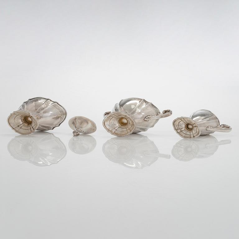 A five-piece sterling silver coffee and tea service, and 12 spoons, USA, first quarter of the 20th century.