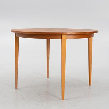 A teak-veneered dining table, mid 20th century.