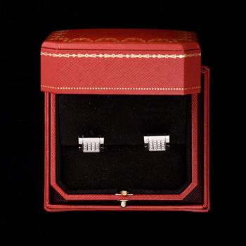 MANSCHETTKNAPPAR, Cartier, 18K vitguld, valkokultaa, 32 diamanter, tot. ca 0,64 ct. Vikt 22 g. Box, certifikat. 2007.