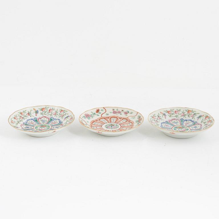 A pair of Chinese famille rose porcelain covers, and three saucers, late Qing dynasty, 19th century.