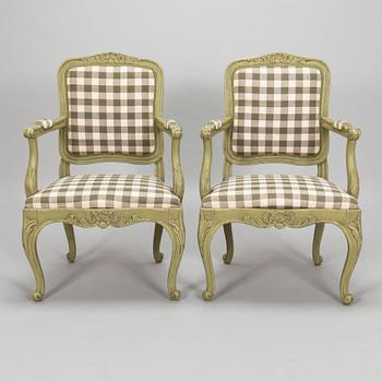 A pair of 20th century  Rococo style armchairs.