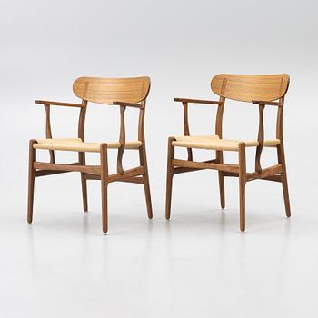 Hans J. Wegner, a pair of CH26 armchairs, Carl Hansen & Son, Denmark, samtida tillverkning.