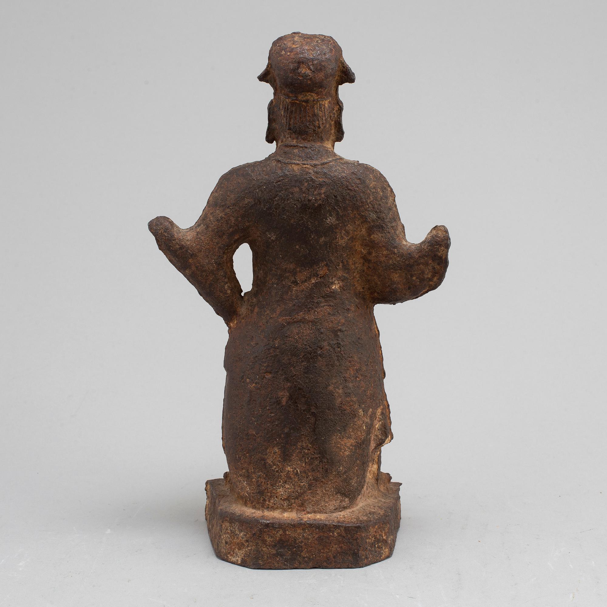 A cast sculpture of a gurads man, presumably Ming dynasty.