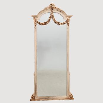 An early 1900s Louis XVI style floor mirror.