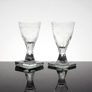 A set of 11 cut and etched liquer glasses, 19th Century.