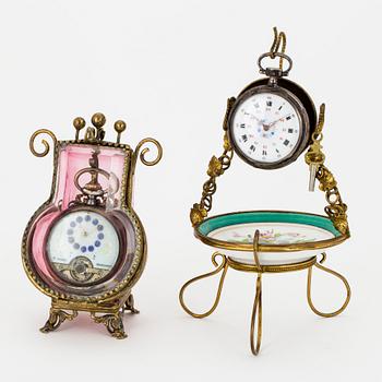 TWO POCKET WATCHES WITH STANDS.